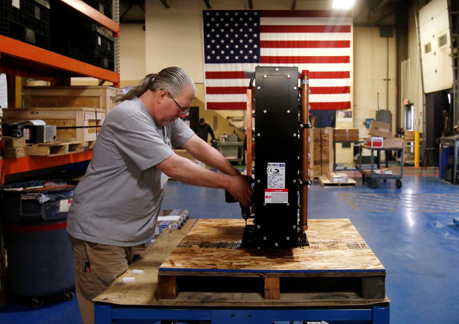 Receiving and shipping worker Mike Pawloski prepares to ship a newly assembled transformer to a client in the RoMan Manufacturing plant in Grand Rapids, Michigan, U.S. December 12, 2018.  Picture taken December 12, 2018.  REUTERS/Rebecca Cook - RC14D0F95D40