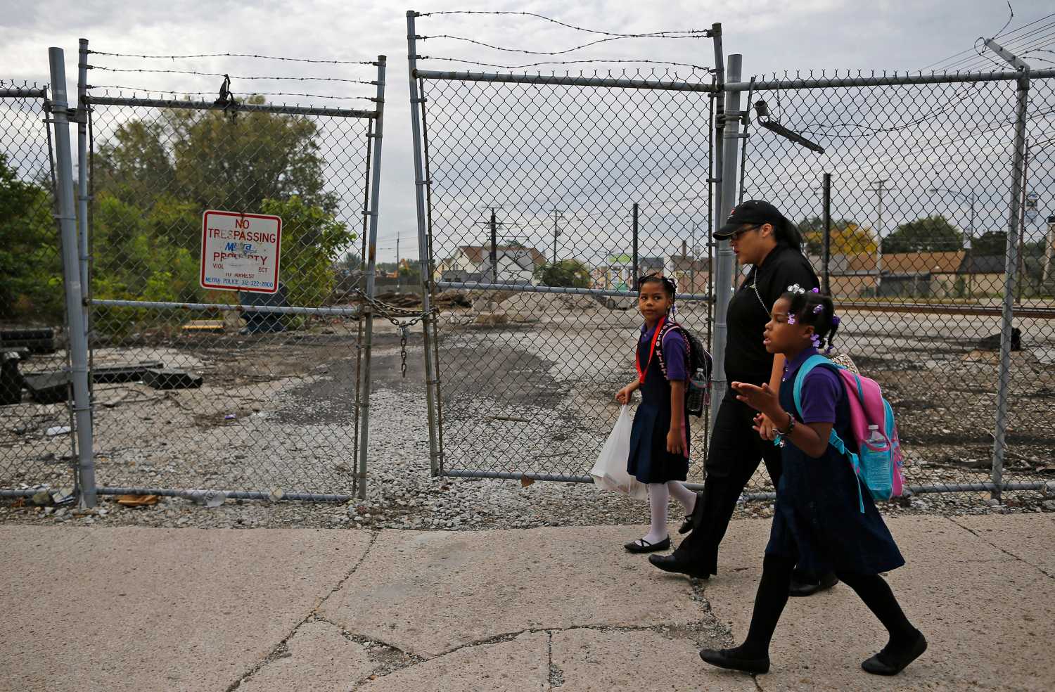 Delores Leonard (center) walks her daughters to school before heading to work at a McDonald's in Chicago, Illinois, on Sept. 25, 2014. Leonard, a single mother, has been working at McDonald's for seven years and has never made more than minimum wage.