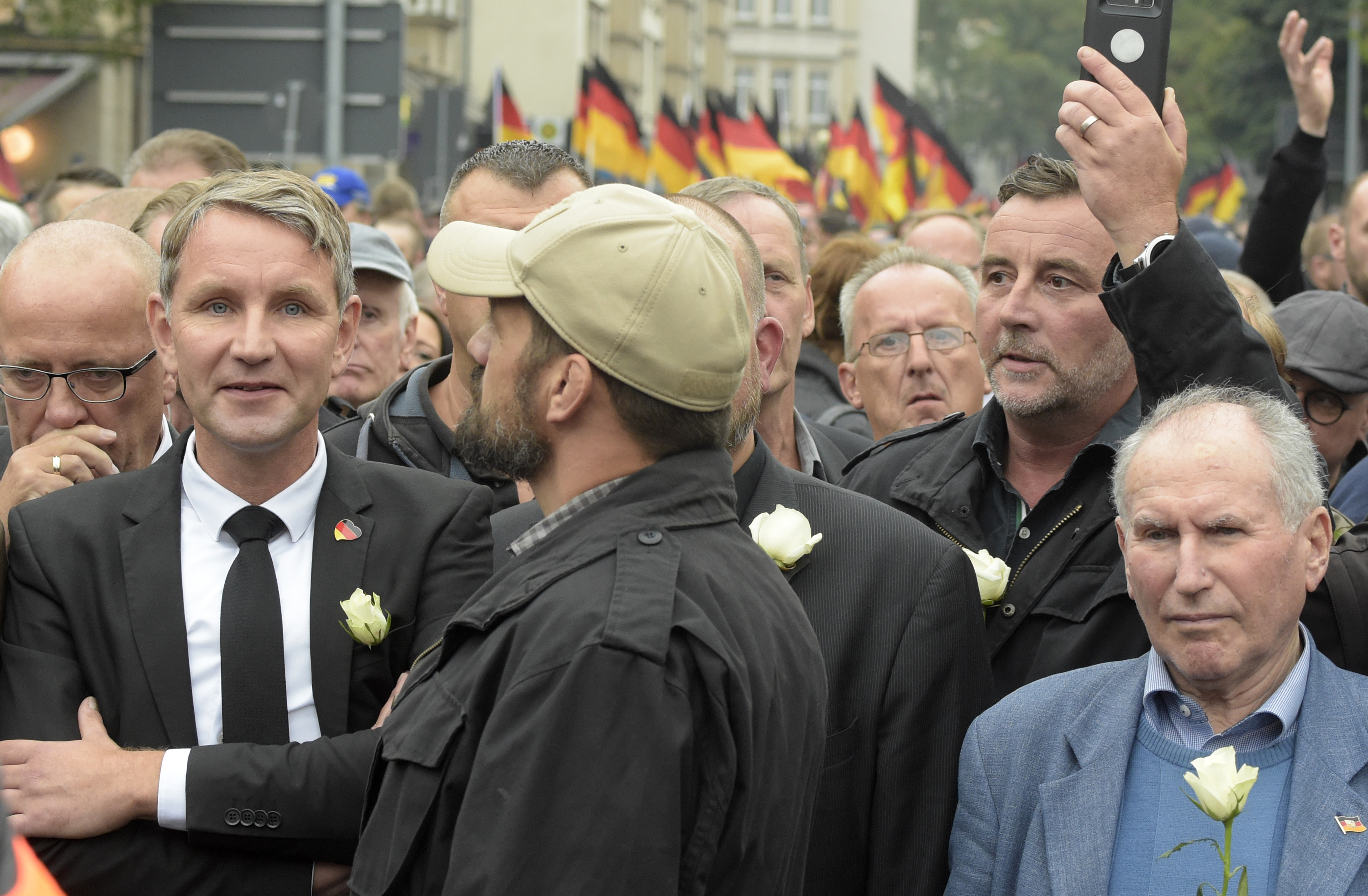 Alternative for Germany regional leader Björn Höcke (left) and PEGIDA founder Lutz Bachmann (second from right) participate in a far-right march in Chemnitz. (Jens Meyer/AP Photo)