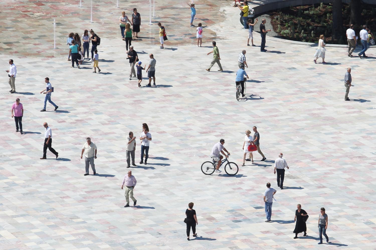 People walk on newly transformed Skenderbeg square in Tirana, Albania June 12, 2017. REUTERS/Florion Goga - RC1370A4B7C0