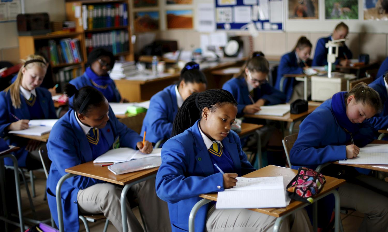 School children attend class at Waterstone College, a private school managed by Curro in the south of Johannesburg July 22, 2015. South African private education group Advtech rejected a takeover offer from its bigger rival Curro Holdings, saying on Tuesday the proposal contained "unacceptable pre-conditions". Advtech's shares fell more than 7 percent shortly after the announcement that it had rejected Curro's bid, but pared losses to close down 2.93 percent at 11.60 rand. The shares are up about 30 percent so far this year. Curro's stock shed 0.83 percent to close on 11.70 rand. REUTERS/Siphiwe Sibeko  - GF10000166738