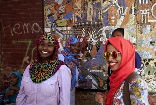 Students laugh and share a joke outside their classroom at the Sudan University of Science and Technology in Khartoum, Sudan, May 14, 2015. In Sudan, which faces insurgences in the western region of Darfur and along its border with breakaway South Sudan, as well as double-digit inflation and high unemployment, life goes on for young people in the capital Khartoum. As well as studying, for those who can afford it, the urban young of Sudan play football and netball, swim and fish in the nearby River Nile, attend prayers at local mosques and enjoy concerts or family celebrations. Other entertainment includes watching U.K. football matches and films on TV, with Facebook being ever popular for chatting amongst friends. REUTERS/Mohamed Nureldin AbdallahPICTURE 11 OF 28 FOR WIDER IMAGE STORY "YOUTH OF TODAY IN SUDAN". SEARCH "YOUNG NURELDIN" FOR ALL IMAGES - GF10000121814