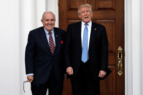 U.S. President-elect Donald Trump stands with former New York City Mayor Rudolph Giuliani before their meeting at Trump National Golf Club in Bedminster, New Jersey, U.S., November 20, 2016.  REUTERS/Mike Segar - S1AEUNZGGLAB