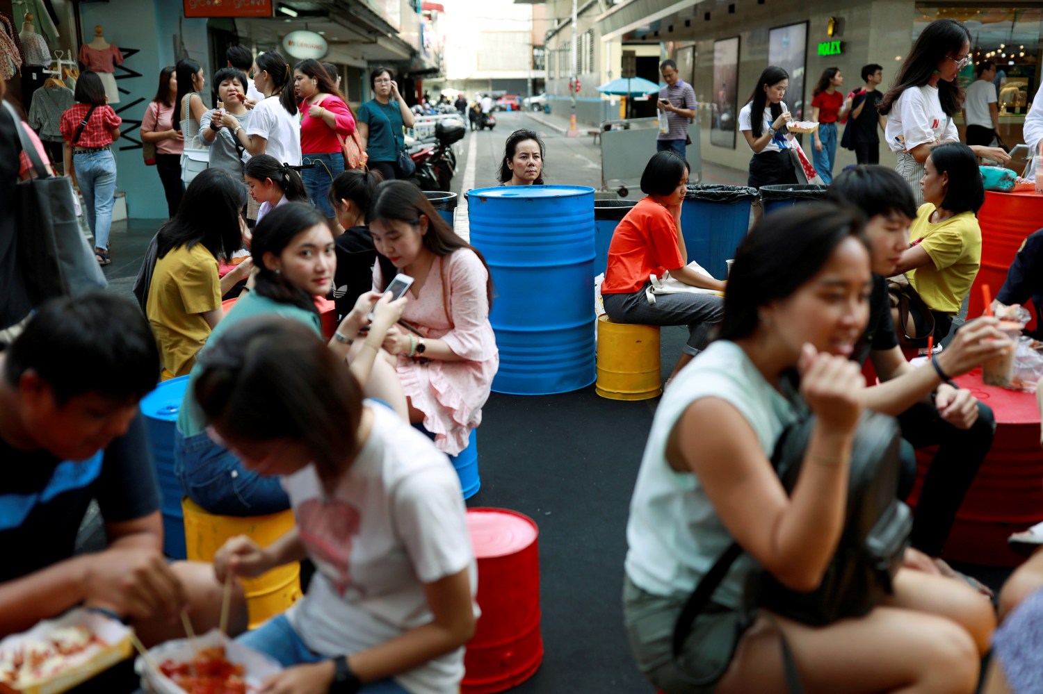 REFILE - CORRECTING STYLE People spend their time at a street food market in Bangkok, Thailand August 25, 2019. REUTERS/Soe Zeya Tun - RC1EAEB197C0
