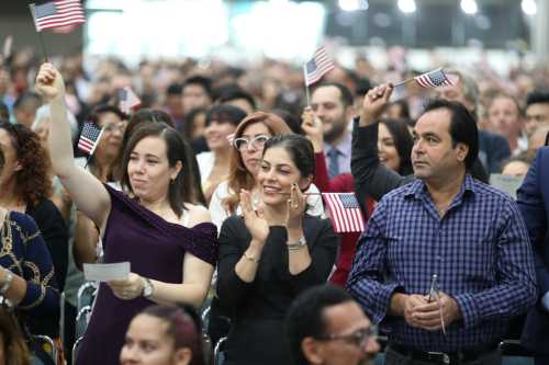 Immigrants are sworn in as new U.S. citizens at a naturalization ceremony in Los Angeles, California, U.S., August 22, 2019. REUTERS/Lucy Nicholson - RC1AFC189020
