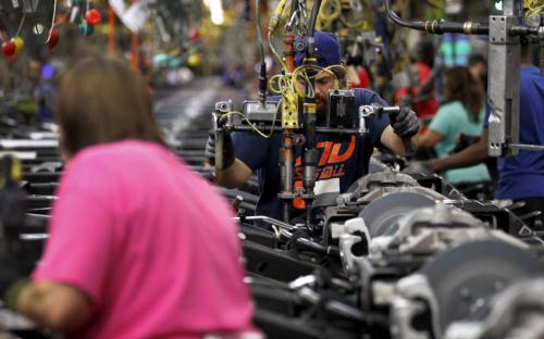 Jacob Bailey conducts assembly on an SUV chassis at the General Motors Assembly Plant in Arlington, Texas June 9, 2015. General Motors Co is raising the stakes on its bet that sales of fuel-thirsty sport utility vehicles will keep driving its global profits as Chinese and other markets sag. GM said on July 14, 2015 that it plans to spend $1.4 billion to modernize the factory in Arlington, Texas, that builds the Cadillac Escalade, Chevrolet Suburban and GMC Yukon sport utility vehicles. It's the largest single investment in a $5.4 billion, three-year plant upgrade program announced earlier this year. Picture taken June 9, 2015. To match Insight GM-SUVS/ REUTERS/Mike Stone	 - GF10000166170