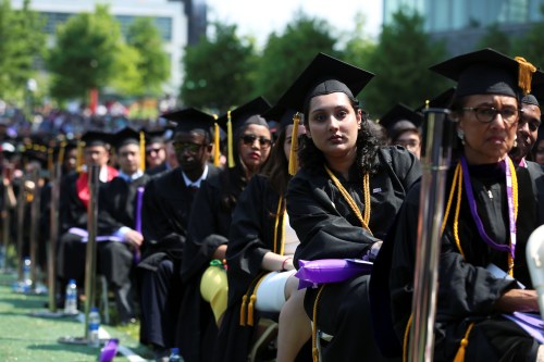 Graduates of The City College of New York sit in their seats at their commencement ceremony in Manhattan on May 31, 2019. REUTERS/Gabriela Bhaskar - RC1E2B862140
