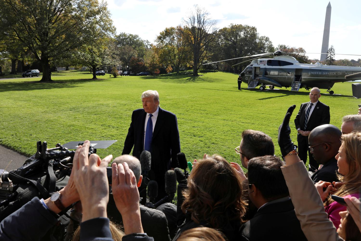 U.S. President Donald Trump speaks to the news media before boarding Marine One to depart for travel to Georgia from the South Lawn of the White House in Washington, U.S., November 8, 2019. REUTERS/Leah Millis - RC247D90BIFM