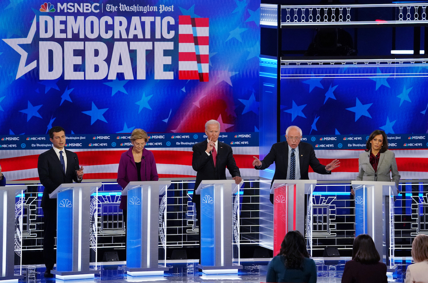 Democratic U.S. presidential candidates (L-R) South Bend Mayor Pete Buttigieg, Senator Elizabeth Warren, former Vice President Joe Biden and Senator Kamala Harris listen as Senator Bernie Sanders speaks during their fifth 2020 campaign debate at the Tyler Perry Studios in Atlanta, Georgia, U.S. November 20, 2019. REUTERS/Brendan McDermid - HP1EFBL07440M