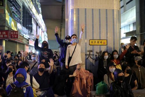 Protesters raise their hands outside the Polytechnic University (PolyU) in Hong Kong, China, November 25, 2019. REUTERS/Marko Djurica - RC2DID9XD607