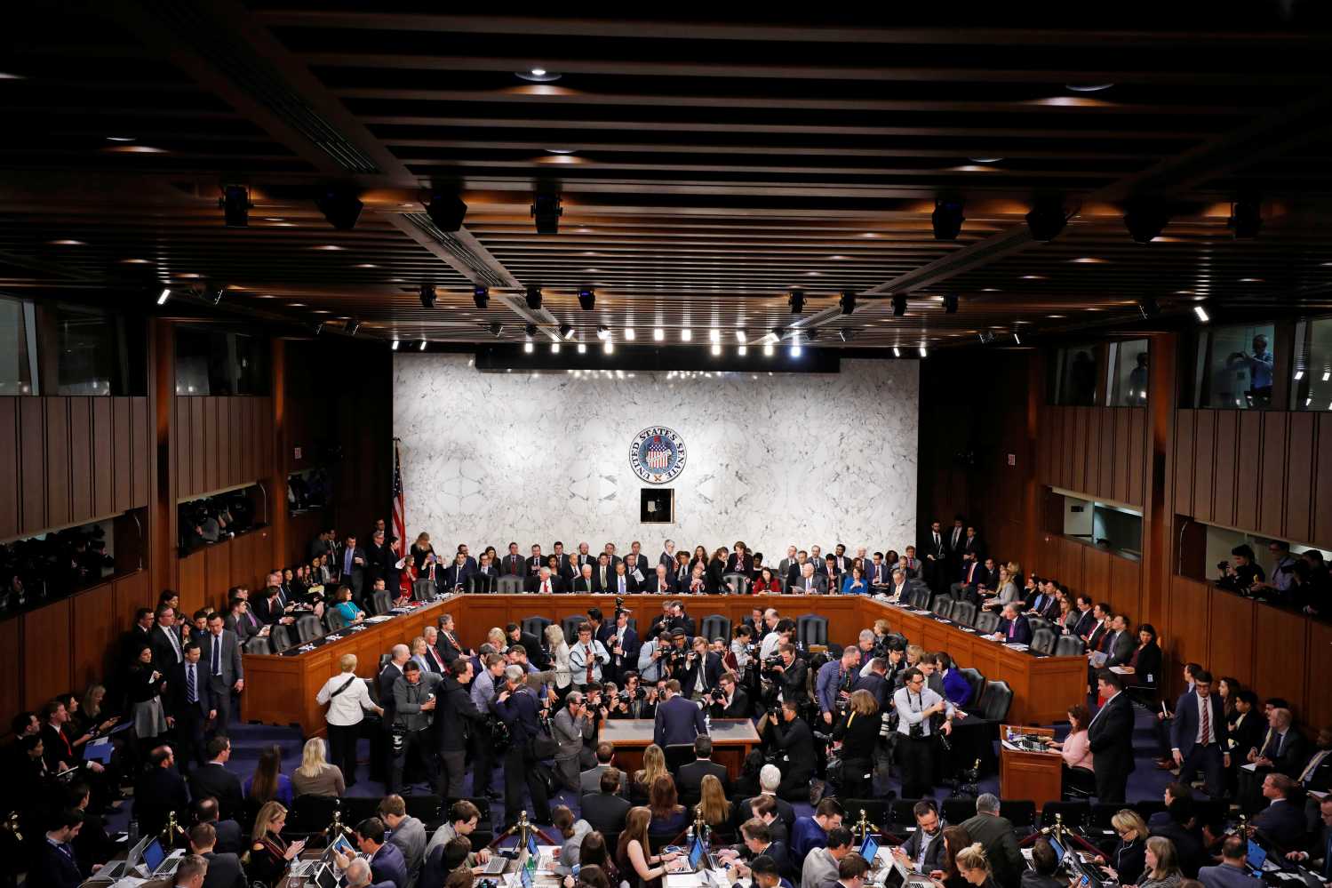 QUALITY REPEAT   Facebook CEO Mark Zuckerberg is surrounded by members of the media as he sits down to testify before a joint Senate Judiciary and Commerce Committees hearing regarding the company's use and protection of user data, on Capitol Hill in Washington, U.S., April 10, 2018. REUTERS/Aaron P. Bernstein - RC15E5907460