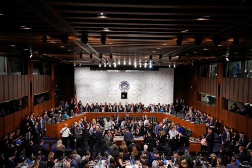 QUALITY REPEAT   Facebook CEO Mark Zuckerberg is surrounded by members of the media as he sits down to testify before a joint Senate Judiciary and Commerce Committees hearing regarding the company's use and protection of user data, on Capitol Hill in Washington, U.S., April 10, 2018. REUTERS/Aaron P. Bernstein - RC15E5907460