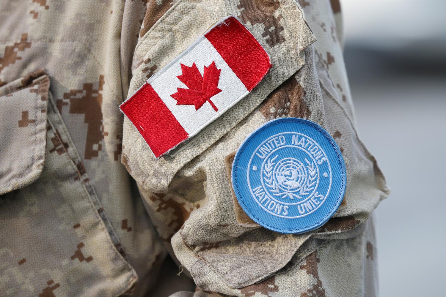 A Canada flag patch and U.N. patch are seen on a member of Canadian Forces before departing for a United Nations peacekeeping mission in Mali, at Canadian Forces Base Trenton in Trenton, Ontario, Canada, July 5, 2018. REUTERS/Chris Wattie - RC1B5D228C00