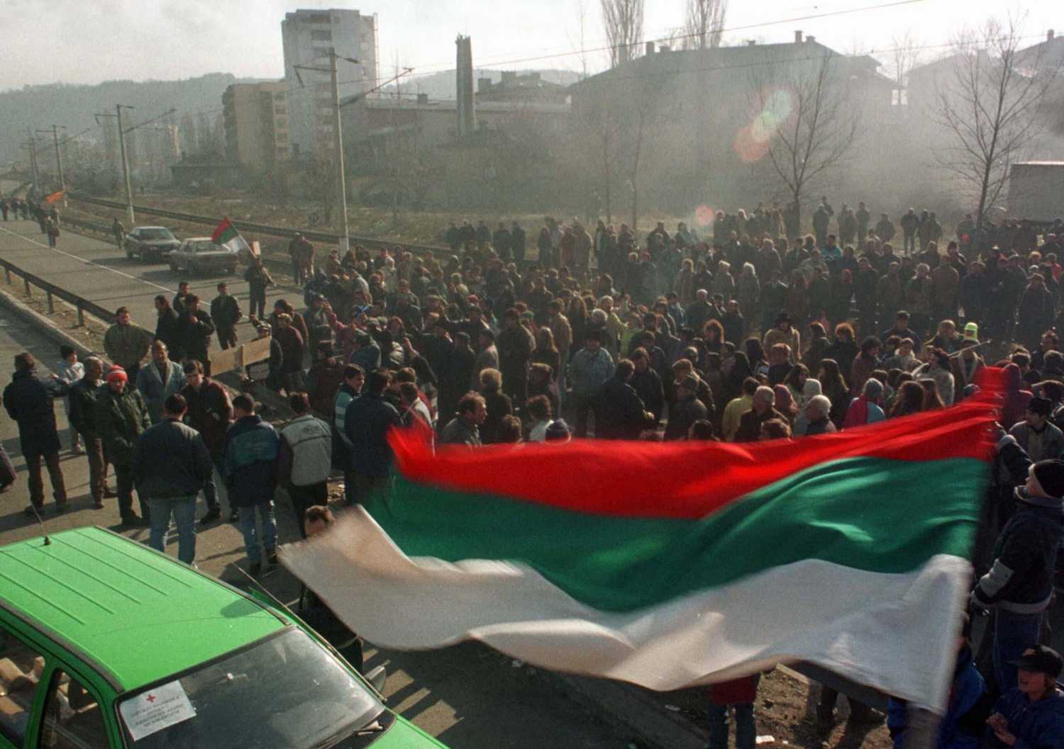 A Bulgarian flag blows in the breeze, as protesters block the main road between Sofia and the Greek border near Doupnitsa, 60 km south of the capital January 30. The angry citizens of Doupnitsa turned out in shifts in freezing cold to blockade road and rail routes to Greece for a second day, in protest against Bulgaria's Socialist rulers.BULGARIA BLOCKADE - RP1DRIDBQHAA