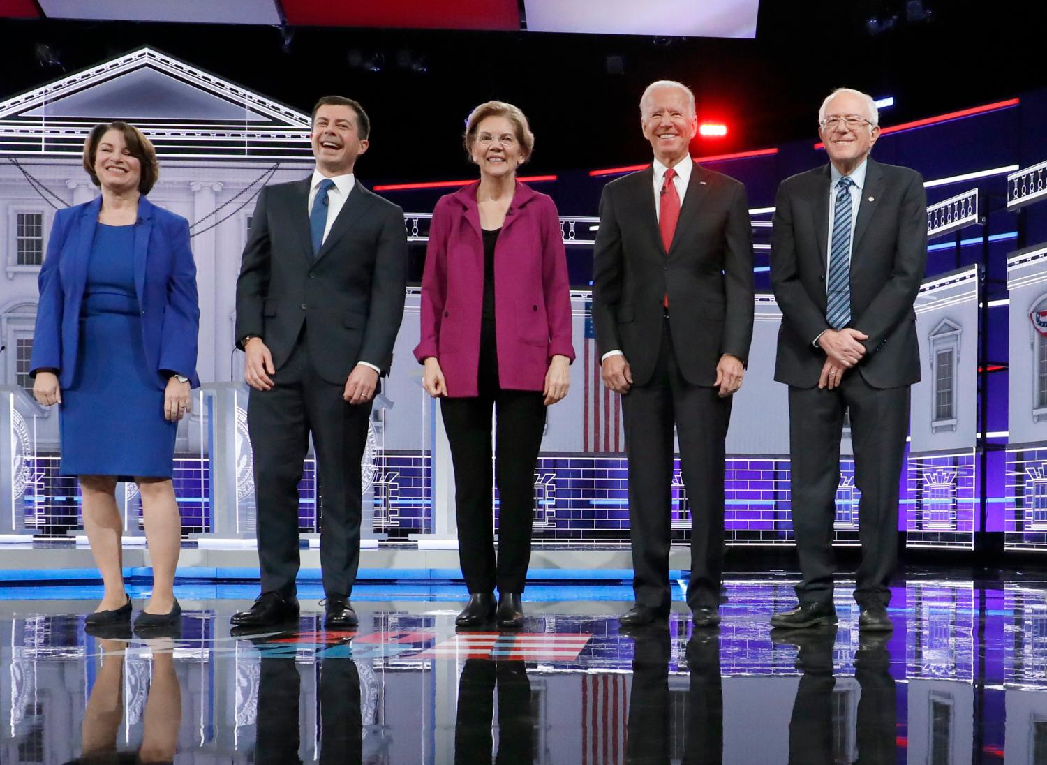 Democratic U.S. presidential candidates Senator Amy Klobuchar, South Bend Mayor Pete Buttigieg, Senator Elizabeth Warren, former Vice President Joe Biden, and Senator Bernie Sanders pose at the start of their fifth 2020 campaign debate at the Tyler Perry Studios in Atlanta, Georgia, U.S. November 20, 2019. REUTERS/Chris Aluka Berry - HP1EFBL060A07