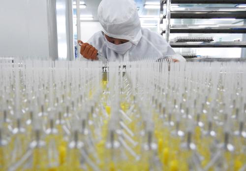 A worker is seen in the workshop of a factory manufacturing medical devices in Lianyungang, Jiangsu province, China July 27, 2018. Picture taken July 27, 2018. REUTERS/Stringer ATTENTION EDITORS - THIS IMAGE WAS PROVIDED BY A THIRD PARTY. CHINA OUT. - RC1FA7C86700