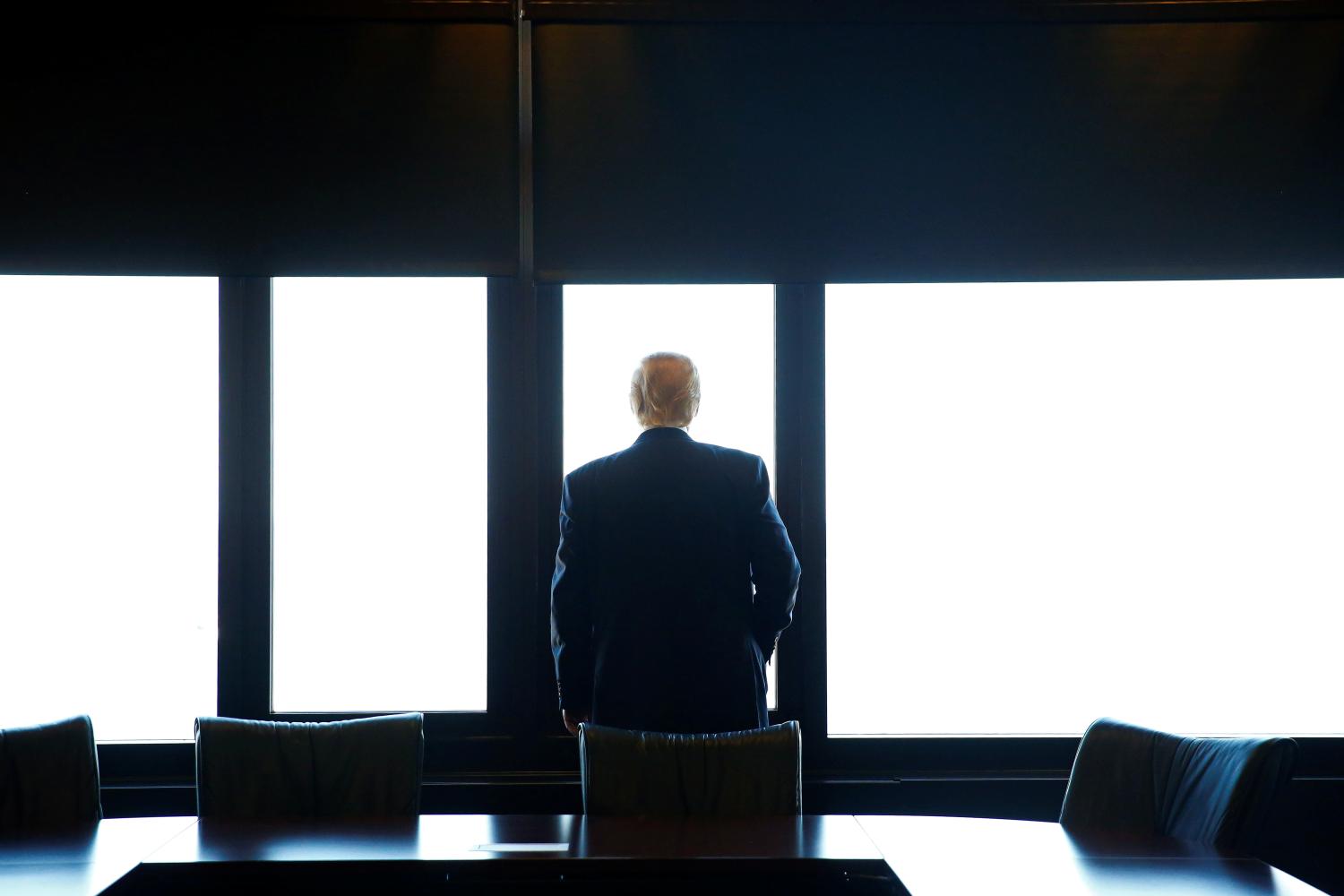 Republican U.S. presidential nominee Donald Trump looks out at Lake Michigan during a visit to the Milwaukee County War Memorial Center in Milwaukee, Wisconsin August 16, 2016. REUTERS/Eric Thayer     TPX IMAGES OF THE DAY      - S1AETVVIYCAA