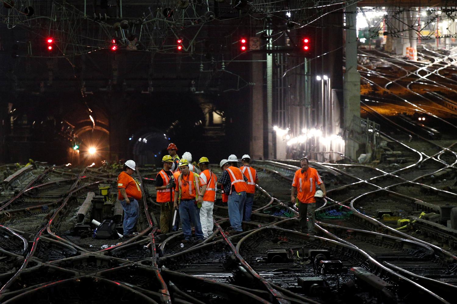 Amtrak track workers work inside the tunnel at New York's Penn Station, the nation's busiest train hub, which will be closing tracks for repairs causing massive disruptions to commuters in New York City, U.S. July 7, 2017. REUTERS/Brendan McDermid TPX IMAGES OF THE DAY - RC1500696CA0