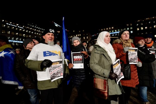 Protesters hold posters at a demonstration against the awarding of the 2019 Nobel literature prize to Peter Handke in Stockholm, Sweden December 10, 2019. TT News Agency/Stina Stjernkvist via REUTERS    THIS IMAGE HAS BEEN SUPPLIED BY A THIRD PARTY. SWEDEN OUT. NO COMMERCIAL OR EDITORIAL SALES IN SWEDEN - RC2JSD9XV83Q