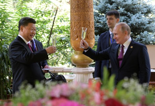 Russian President Vladimir Putin (R) toasts with Chinese President Xi Jinping while congratulating him on his birthday before the Conference on Interaction and Confidence-Building Measures in Asia (CICA) in Dushanbe, Tajikistan June 15, 2019. Sputnik/Alexei Druzhinin/Kremlin via REUTERS  ATTENTION EDITORS - THIS IMAGE WAS PROVIDED BY A THIRD PARTY. - RC1A9AEA7370