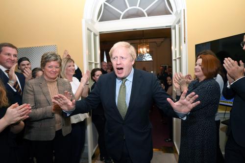 Britain's Prime Minister Boris Johnson is greeted by staff as he arrives back at Downing Street, after meeting Queen Elizabeth and accepting her invitation to form a new government after the Conservative Party was returned to power in the general election with an increased majority, in London, Britain December 13, 2019. Stefan Rousseau/Pool via REUTERS - RC2CUD9C5SL9