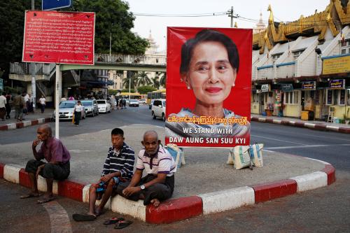 A poster supporting Aung San Suu Kyi as she attends a hearing at the International Court of Justice is seen in a road in Yangon, Myanmar, December 12, 2019. REUTERS/Ann Wang - RC2RTD98VHU5