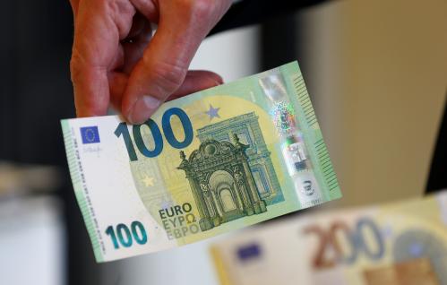 European Central Bank (ECB) Banknotes Director Ton Roos shows the new 100 euro banknote in the secretive vaults inside the Bank of Italy in Rome May 21, 2019. Picture taken May 21, 2019 REUTERS/Yara Nardi - RC177763AD50