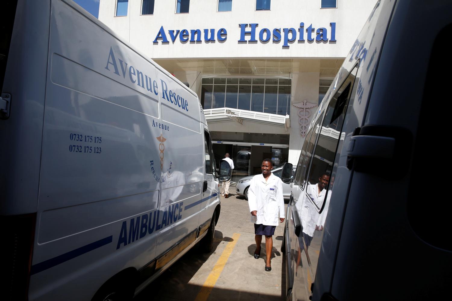 A health worker walks between parked ambulances at the Avenue hospital in Nairobi, Kenya February 1, 2019. Picture taken February 1, 2019. REUTERS/Baz Ratner - RC15F30A3BC0
