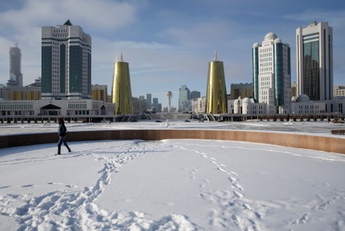 A man walks along a snow-covered square in central Nur-Sultan, Kazakhstan November 28, 2019. REUTERS/Pavel Mikheyev - RC2BKD9QTRAE