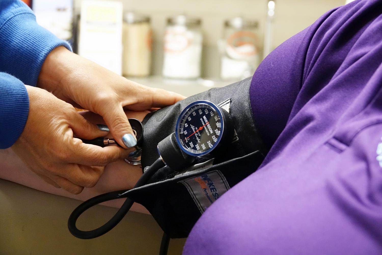 A nurse takes someones blood pressure inside the East Arkansas Family Health Center in Lepanto, Arkansas, U.S., May 2, 2018. Picture taken May 2, 2018.    To match Special Report USA-HEALTHCARE/ARKANSAS     REUTERS/Karen Pulfer Focht - RC1C8E69F7C0