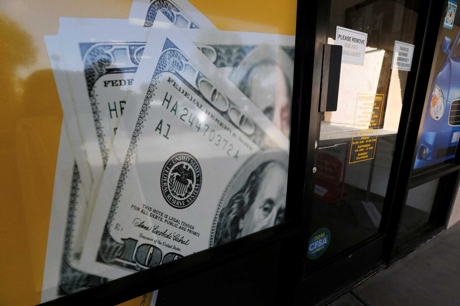 The storefront of an Advance America loan store is shown in Palm Springs, California, U.S. June 2, 2016.  REUTERS/Sam Mircovich - S1AETHPRMZAB