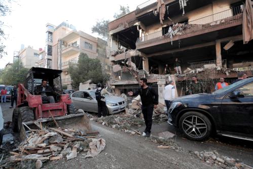 A tractor cleans debris outside a damaged building in Mezzah, Damascus, Syria November 12, 2019. REUTERS/Omar Sanadiki - RC2J9D9H43XW