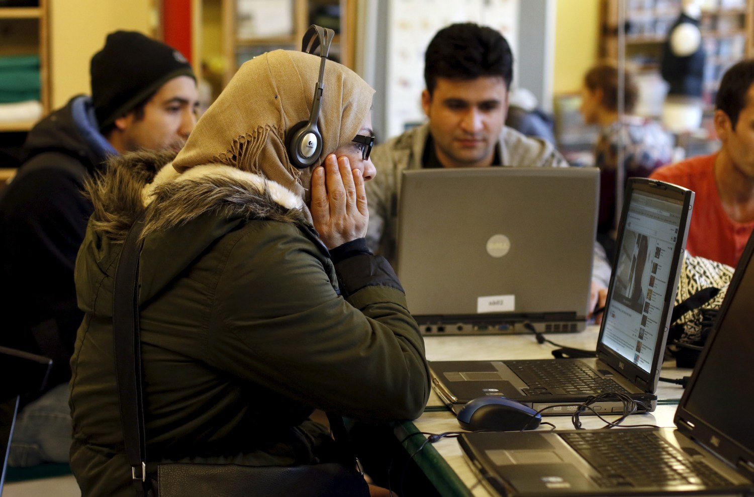 Migrants learn German on laptops at the community centre 'SPIKE Dresden' in Dresden, Germany, March 22, 2016. SPIKE Dresden offers support to refugees and serves as a venue for people under 30 to meet at. REUTERS/Ina Fassbender - GF10000356259
