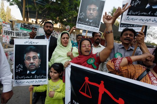 Supporters of former President Pervez Musharraf, head of the All Pakistan Muslim League (APML) political party, chant slogans during a protest demanding a fair trial for him in Karachi March 9, 2014. Musharraf is facing treason charges in a special court in Islamabad. The charges relate to his imposition of a state of emergency in 2007, when he was manoeuvring to extend his rule in the face of growing opposition from the public and the judiciary. REUTERS/Akhtar Soomro  (PAKISTAN - Tags: POLITICS CIVIL UNREST CRIME LAW) - GM1EA391JBG01