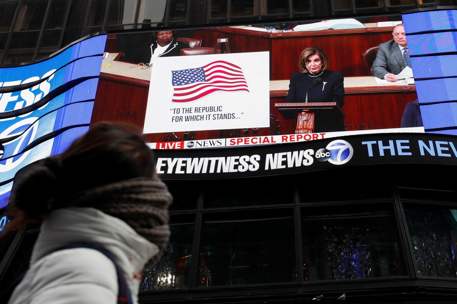 House Speaker Nancy Pelosi (D-CA) is seen on a jumbotron outside ABC News studios speaking to the U.S. House of Representatives during the session to discuss rules ahead of a vote on two articles of impeachment against U.S. President Donald Trump, at Times Square in New York City, New York, U.S., December 18, 2019.  REUTERS/Shannon Stapleton - RC2UXD9M3GK1