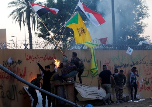 Protesters and militia fighters gather to condemn air strikes on bases belonging to Hashd al-Shaabi (paramilitary forces), outside the main gate of the U.S. Embassy in Baghdad, Iraq December 31, 2019. REUTERS/Wissm al-Okili