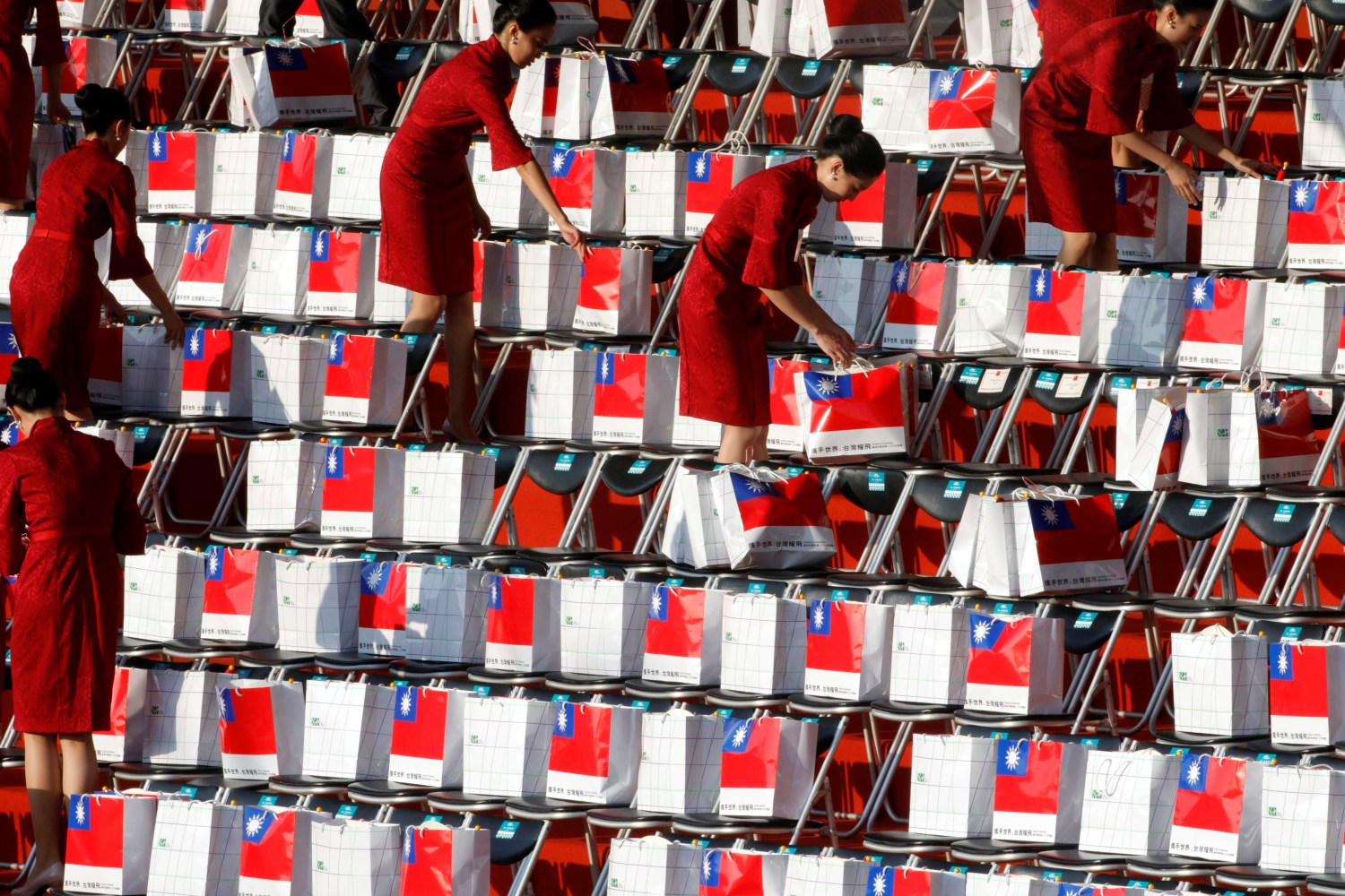Staff members place boxes in chairs before the National Day celebrations in front of the Presidential Palace in Taipei, Taiwan, October 10, 2019. REUTERS/Eason Lam - RC1A7C3144B0