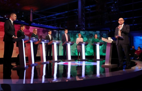 BBC presenter Nick Robinson speaks in front of Plaid Cymru leader Adam Price, former Green Party co-leader Caroline Lucas, Labour Party's shadow business secretary Rebecca Long Bailey, Conservative Party's Chief Secretary to the Treasury Rishi Sunak, Brexit Party chairman Richard Tice, SNP leader and Scottish First Minister Nicola Sturgeon and Liberal Democrat leader Jo Swinson before a general election debate in Cardiff, Britain November 29, 2019. REUTERS/Hannah McKay/Pool - RC27LD97TG7M