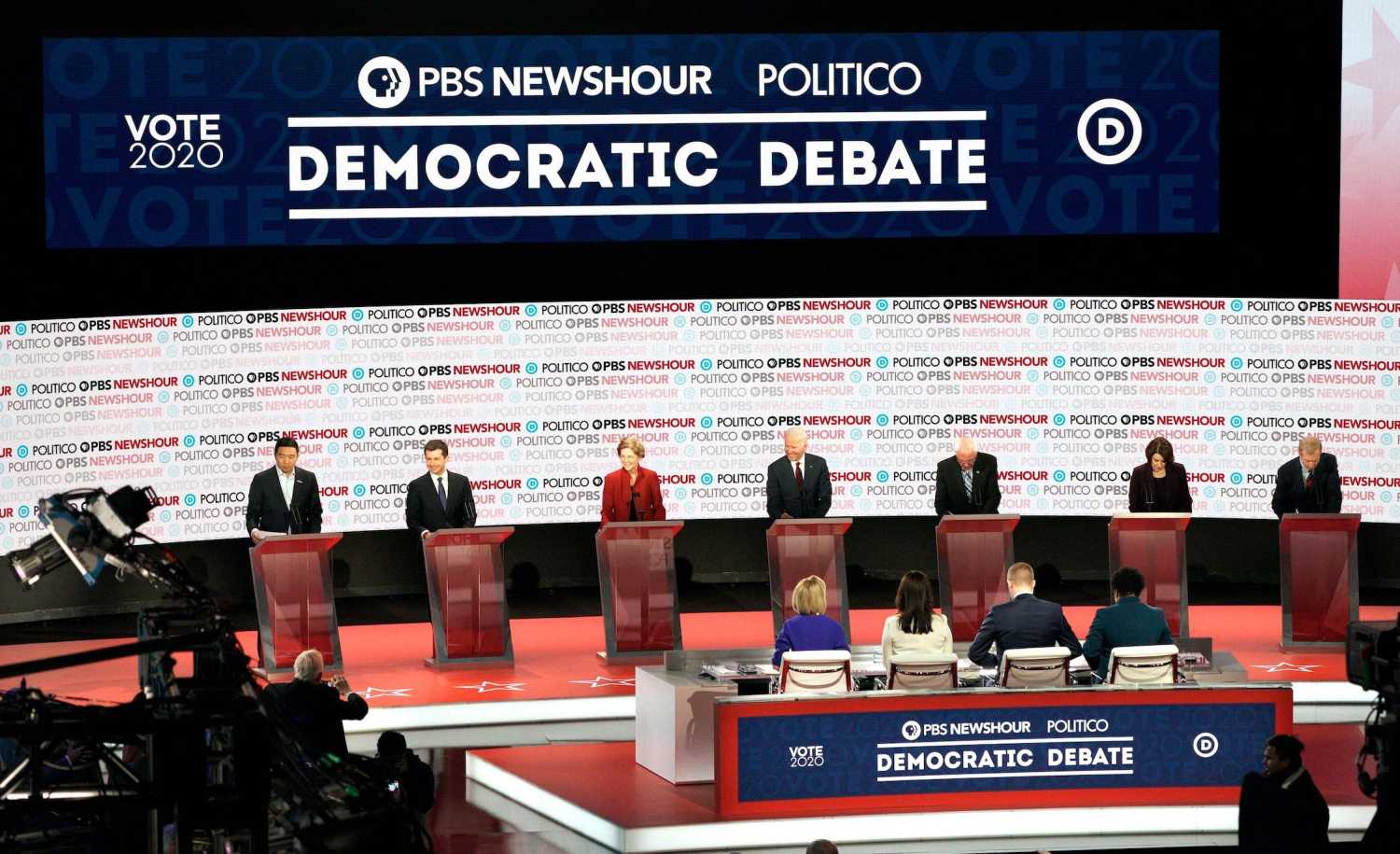 Democratic presidential candidates entrepreneur Andrew Yang, South Bend Mayor Pete Buttigieg, Senator Elizabeth Warren, former Vice President Joe Biden, Senator Bernie Sanders, Senator Amy Klobuchar and billionaire activist Tom Steyer on the stage for the sixth 2020 U.S. Democratic presidential candidates campaign debate at Loyola Marymount University in Los Angeles, California, U.S., December 19, 2019. REUTERS/Kyle Grillot