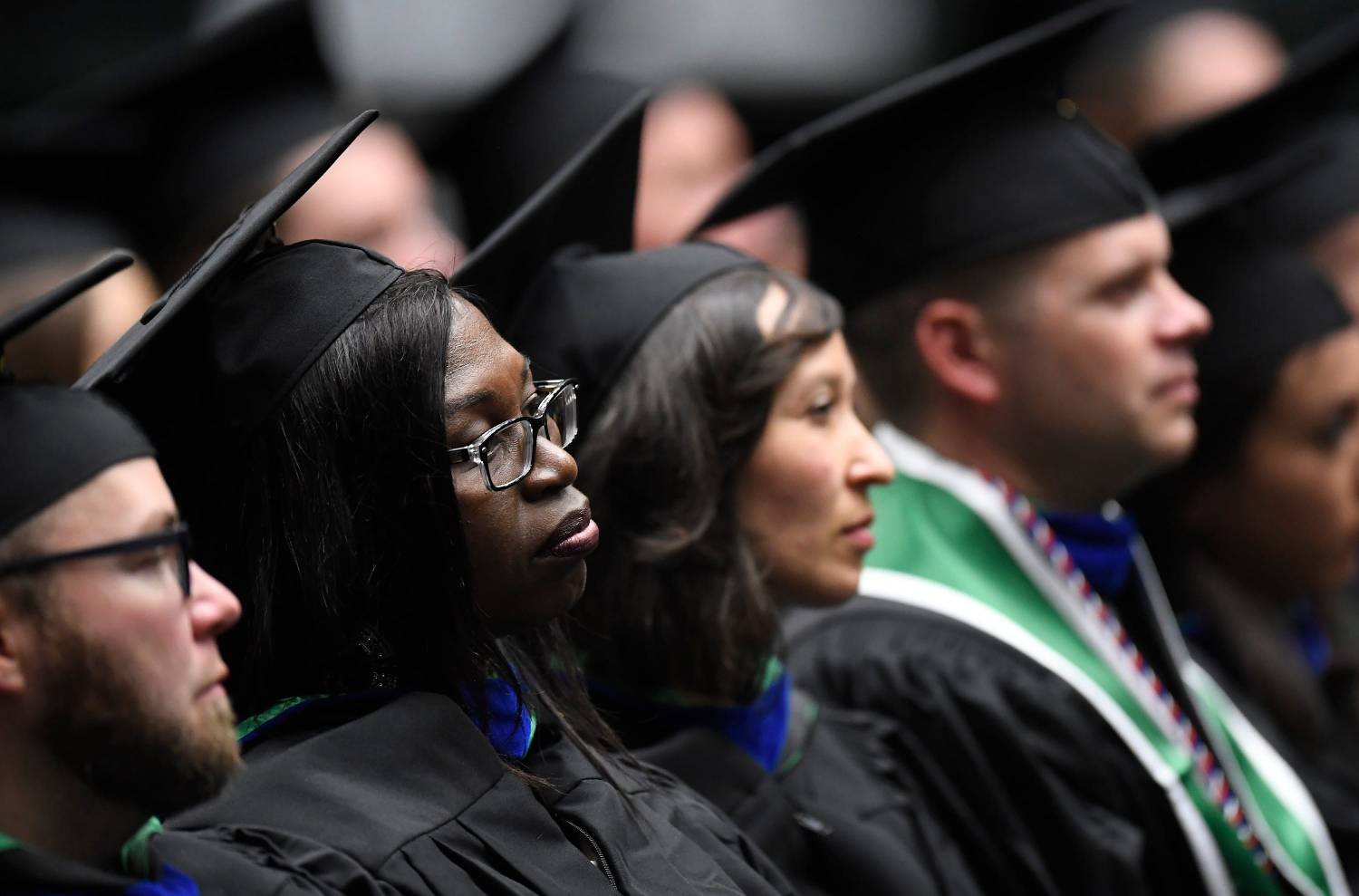 Students listen to the student speaker during the graduation ceremony for the College of Business in Moby Arena at Colorado State University in Fort Collins, Colo. on Friday, Dec. 20, 2019.122019 Csu Cobgraduation 08 Bb