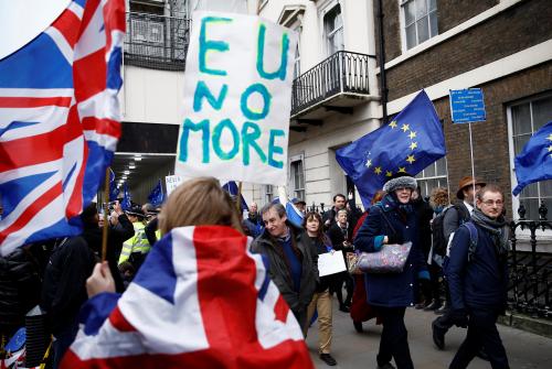 Pro-Brexit supporters celebrate Britain leaving the EU on Brexit day as anti-Brexit demonstrators are seen walking in the opposite way in London, Britain January 31, 2020. REUTERS/Henry Nicholls