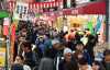 Shoppers crowd at the Kuromon Ichiba to purchase ingredients for New Year's dishes in Osaka on Dec. 30, 2019, the end of year. Shops were overflowing with marine products such as crab, tuna, meat and processed foods.   ( The Yomiuri Shimbun )