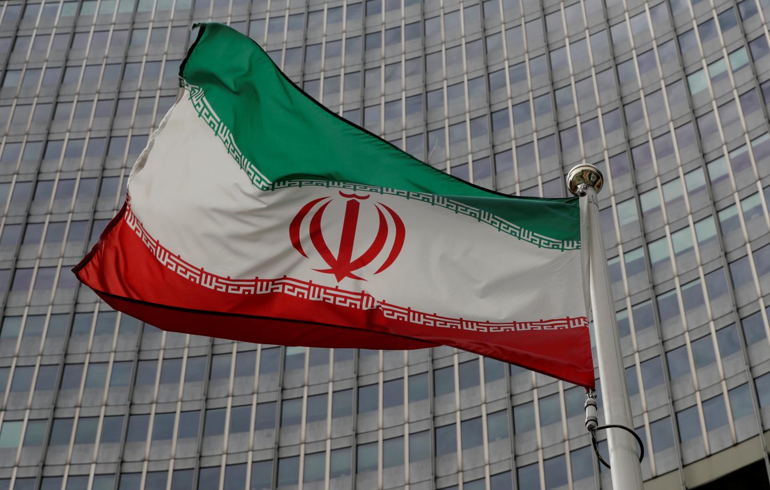 An Iranian flag flutters in front of the International Atomic Energy Agency (IAEA) headquarters in Vienna, Austria September 9, 2019.   REUTERS/Leonhard Foeger - RC13159EFD90