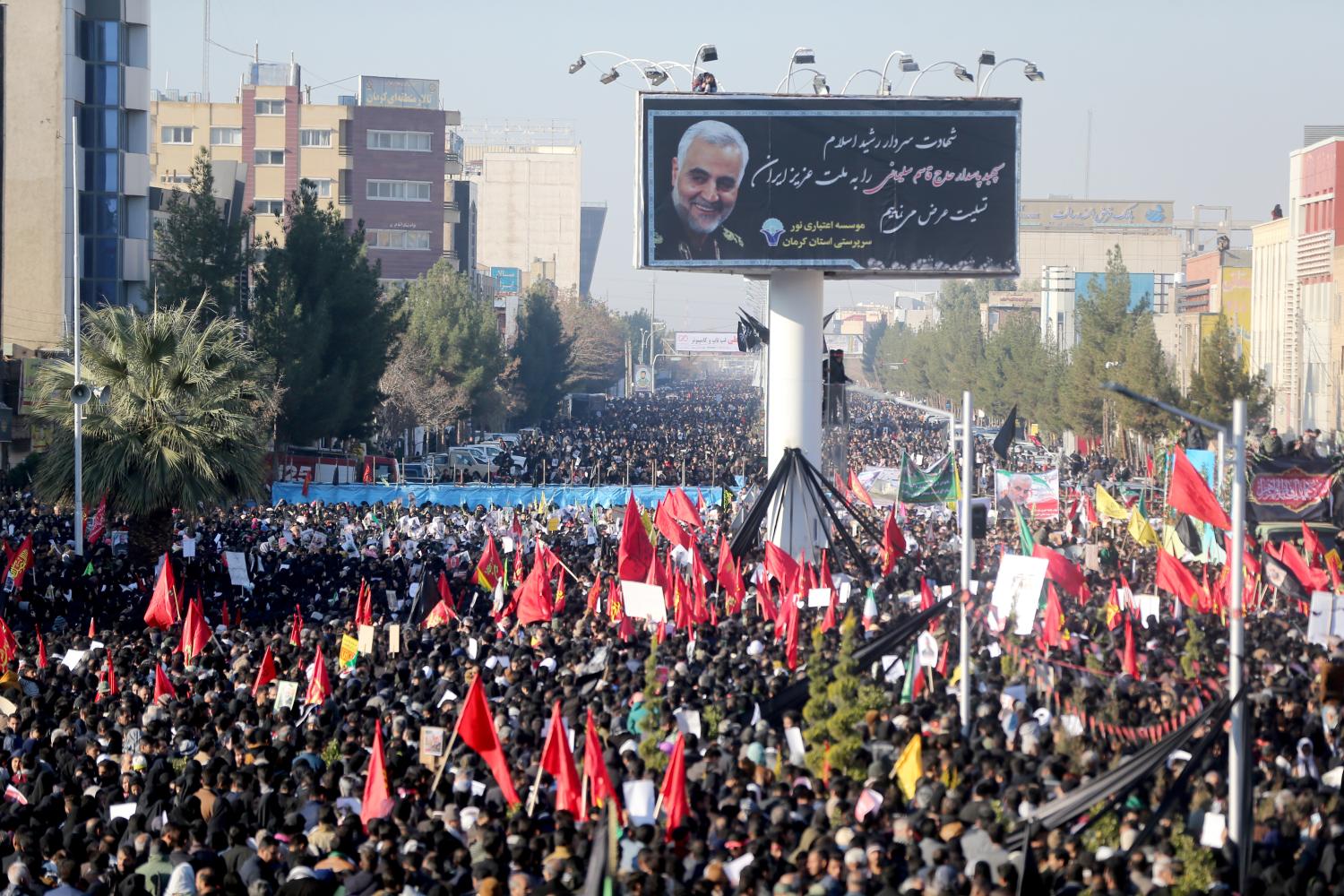 Iranian people attend a funeral procession and burial for Iranian Major-General Qassem Soleimani, head of the elite Quds Force, who was killed in an air strike at Baghdad airport, at his hometown in Kerman, Iran January 7, 2020. Mehdi Bolourian/Fars News Agency/WANA (West Asia News Agency) via REUTERS ATTENTION EDITORS - THIS IMAGE HAS BEEN SUPPLIED BY A THIRD PARTY