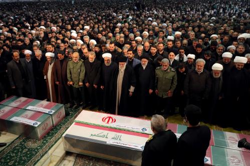 Iran's Supreme Leader Ayatollah Ali Khamenei and President Hassan Rouhani pray near the coffins of Iranian Major-General Qassem Soleimani, head of the elite Quds Force, and Iraqi militia commander Abu Mahdi al-Muhandis, who were killed in an air strike at Baghdad airport, in Tehran, Iran January 6, 2020. Official Khamenei website/Handout via REUTERS ATTENTION EDITORS - THIS IMAGE WAS PROVIDED BY A THIRD PARTY. NO RESALES. NO ARCHIVES