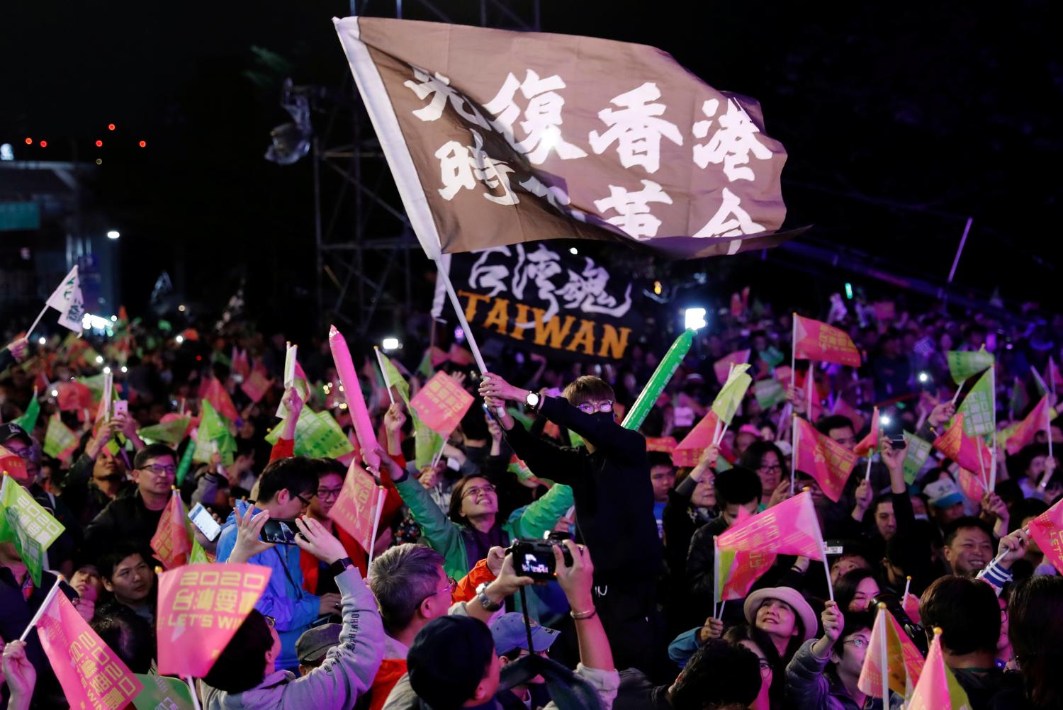 Hong Kong anti-government protesters attend a rally in support of Taiwan President Tsai Ing-wen outside the Democratic Progressive Party (DPP) headquarters in Taipei, Taiwan January 11, 2020. REUTERS/Tyrone Siu