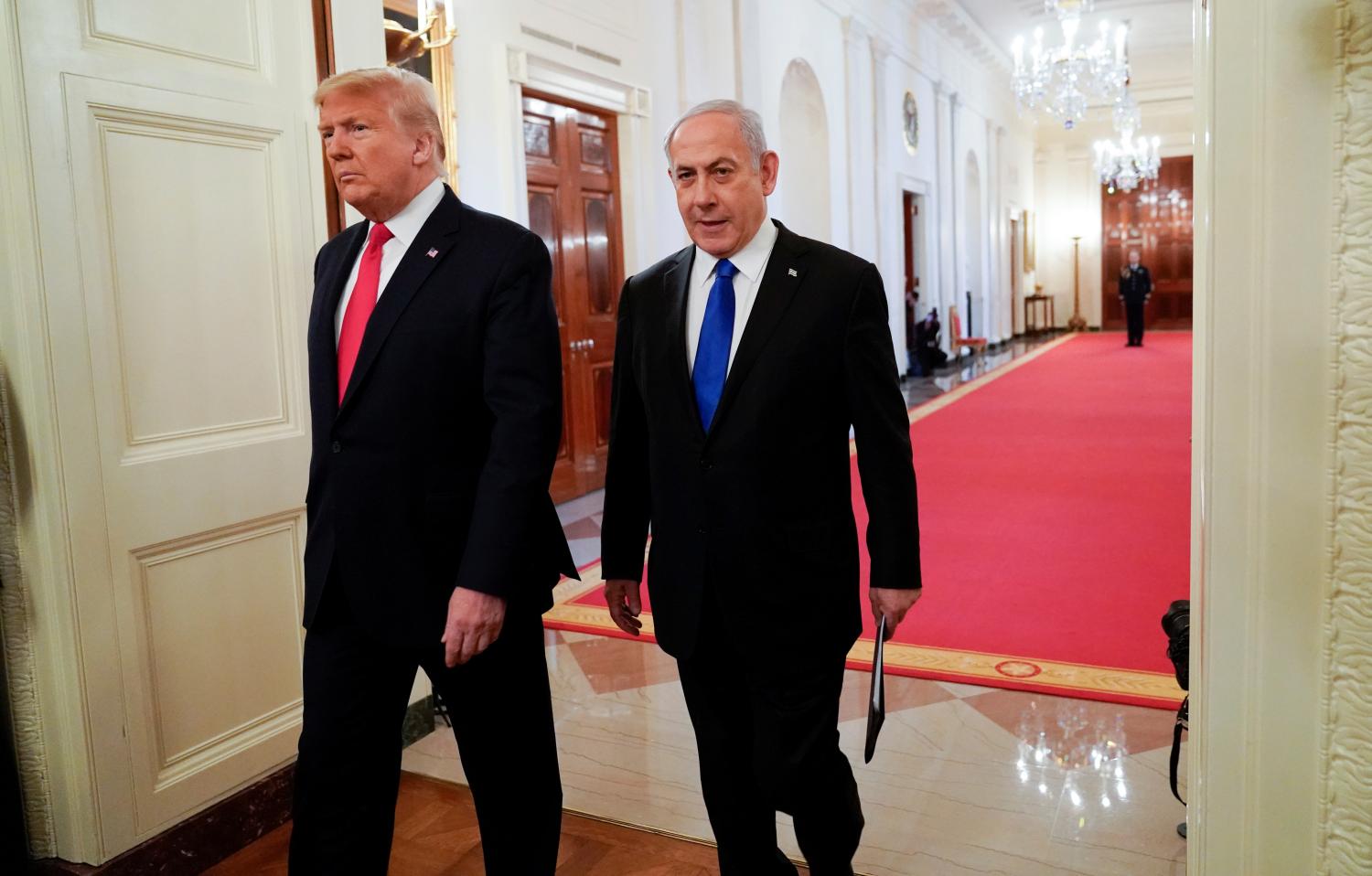 U.S. President Donald Trump and Israel's Prime Minister Benjamin Netanyahu arrive at a joint news conference to discuss a new Middle East peace plan proposal in the East Room of the White House in Washington, U.S., January 28, 2020. REUTERS/Joshua Roberts