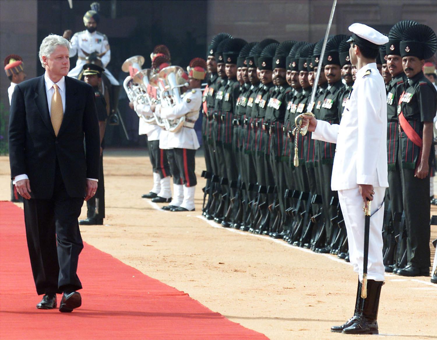United States President Bill Clinton reviews the honour guard during the official welcoming ceremony at the Presidential Palace in New Delhi March 21. Clinton is on an official five day visit to the region. A massacre of 35 Sikh villagers in the rebellion-torn province of Kashmir cast a shadow over the pomp, ceremony and cordiality planned for President Clinton as he opened his visit to India.TS/CC