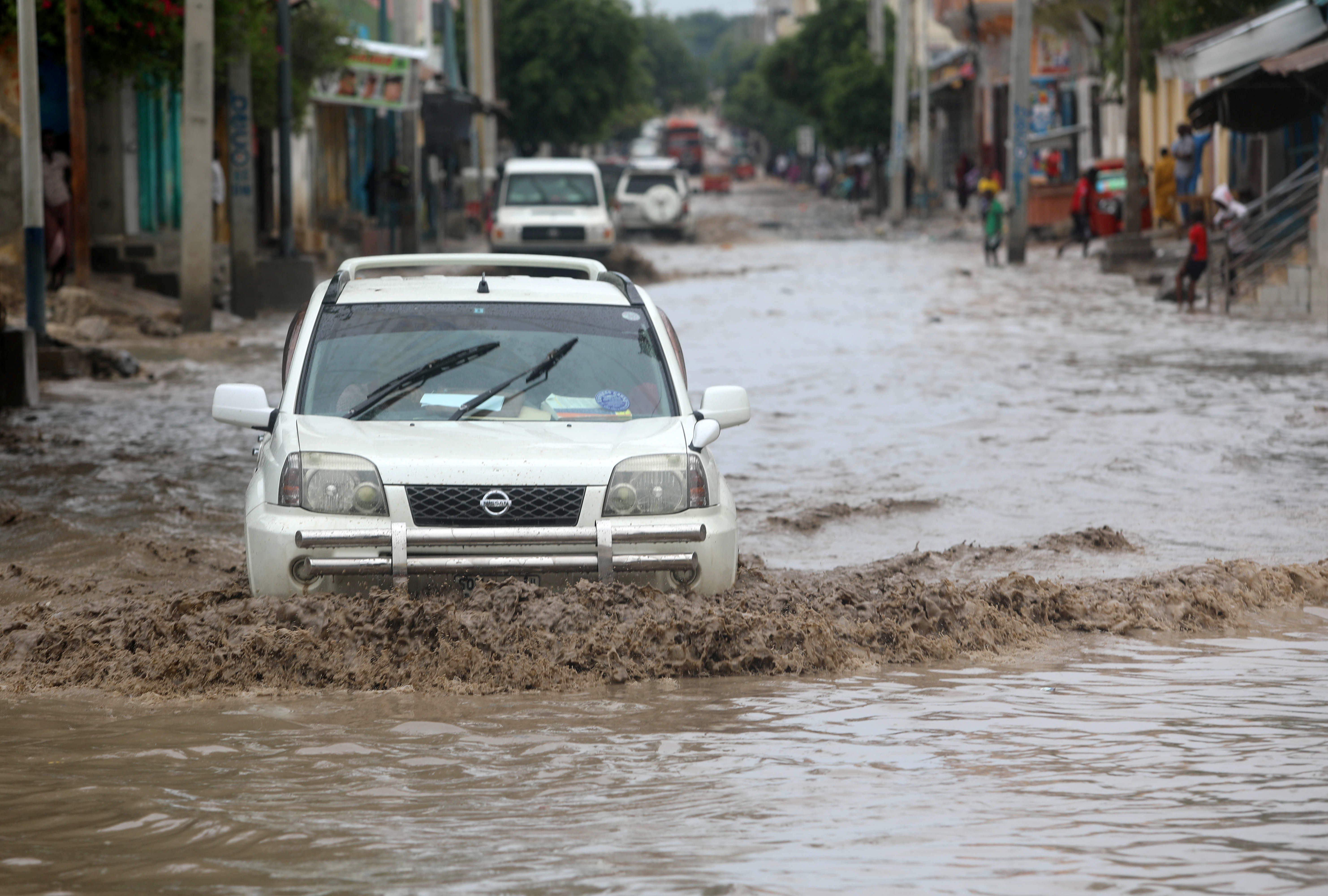 A motorist drives through flood waters after a rainfall along a street in Mogadishu, Somalia November 26, 2019. REUTERS/Feisal Omar - RC22JD9CY7FC