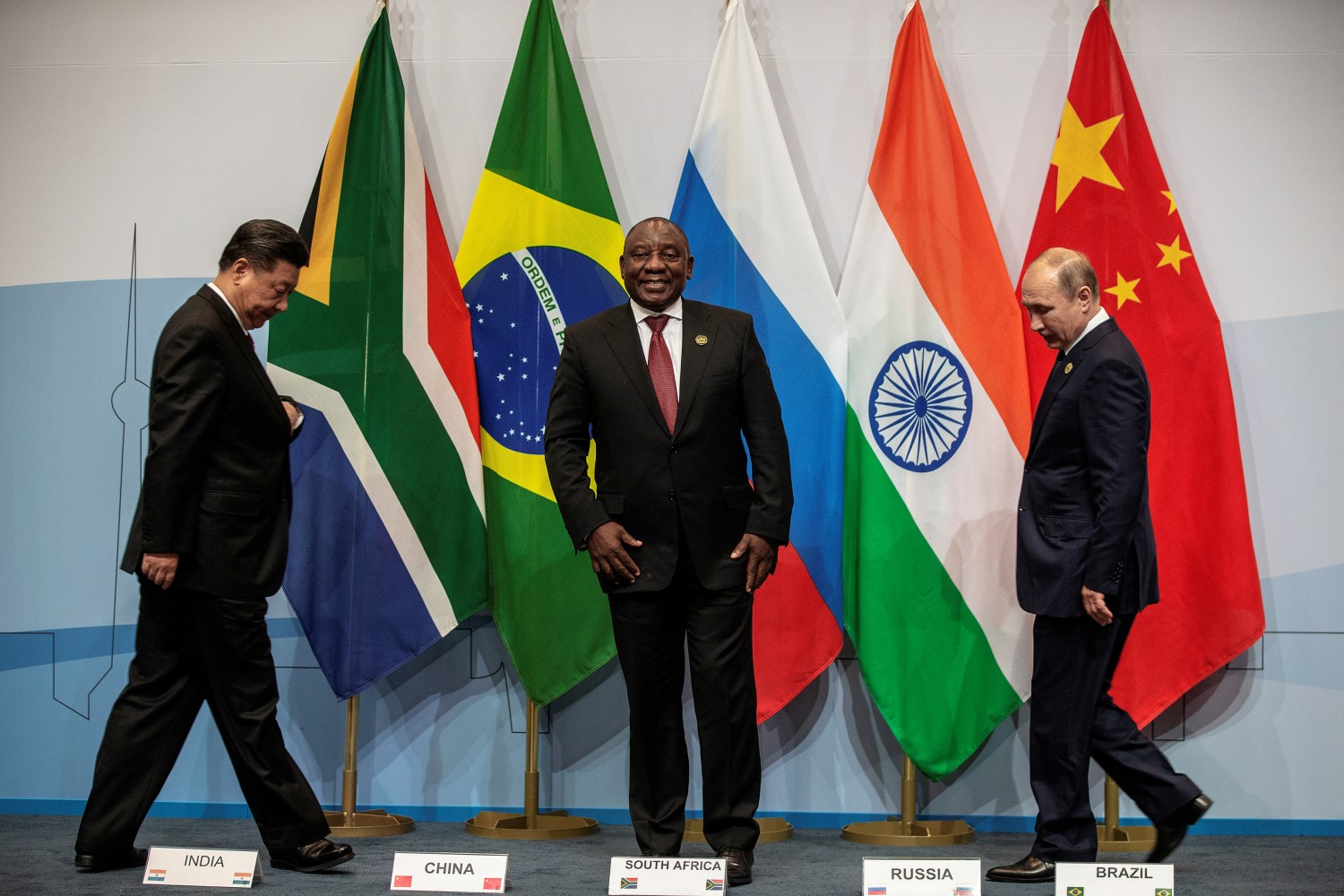 South Africa's President Cyril Ramaphosa, China's President Xi Jinping and Russia's President Vladimir Putin arrive prior to posing for a group picture at the BRICS summit meeting in Johannesburg, South Africa, July 26, 2018. Gianluigi Guercia/Pool via REUTERS? - RC14540D3CE0